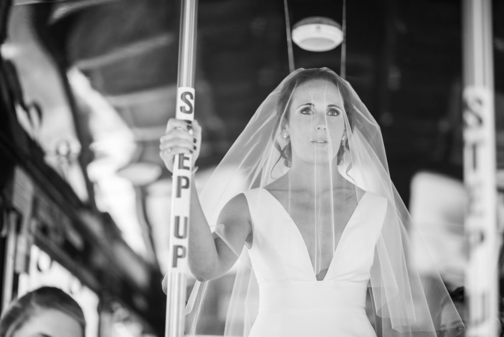 emotional bride in trolley on her way to st cecilia's ceremony