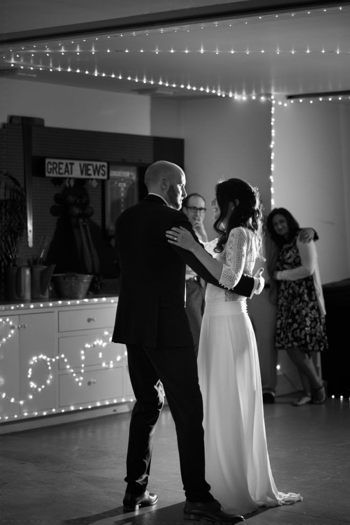 bride and groom dance in garage