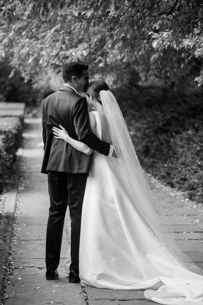 couple pose in garden central park nyc